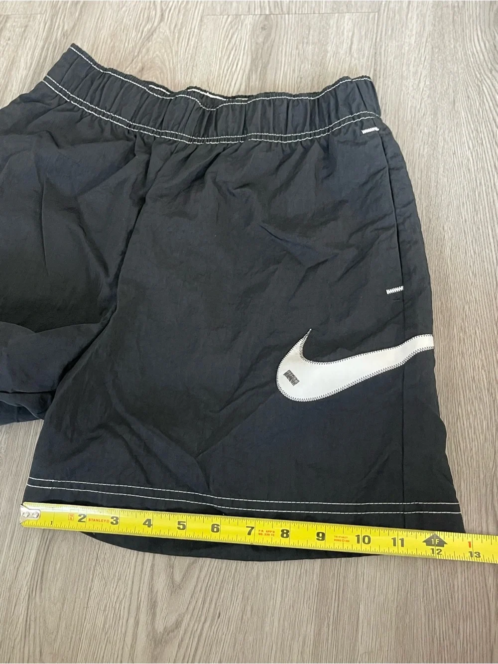 Nike Black Athletic Shorts with White Swoosh Accent